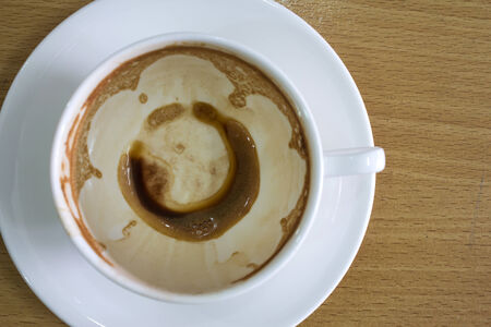 empty and dirty cup of coffeeの写真素材