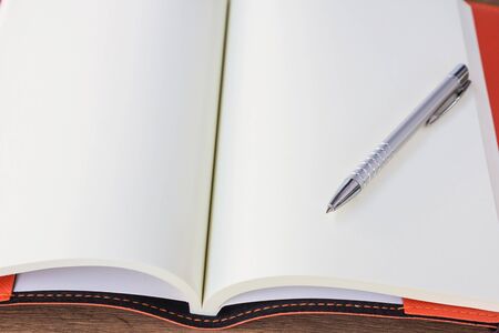 Open empty notebook with pen.の写真素材