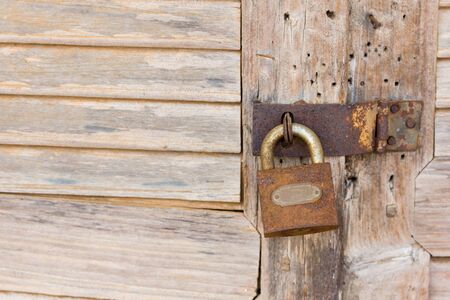 Old master key with wooden doorの写真素材
