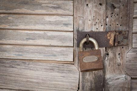 Old master key with wooden doorの写真素材