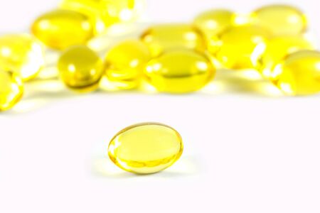 Rice bran oil pills on white backgroundの写真素材