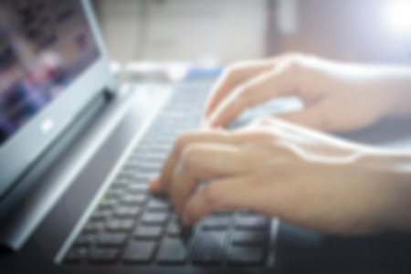 Closeup of woman hands working with laptopの写真素材
