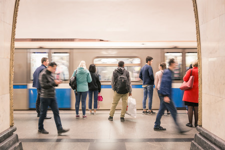 Moscow, Russia - September 23, 2017: Blurry scene of arriving Metro and hurry passengers at bright platform in Moscow Metro system.のeditorial素材
