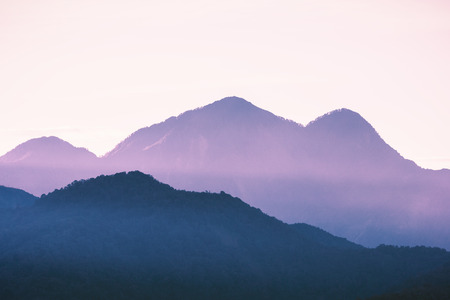 Mountain peaks touching light after sunset turned to sweet purple color at Sun Moon Lake, Nantou of Taiwan.の写真素材
