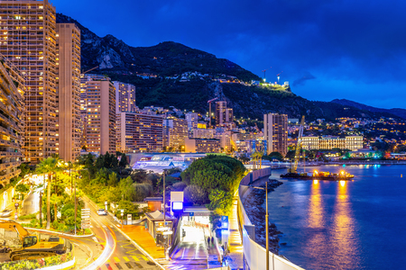 Monte Carlo, Monaco - October 1, 2018: Twilight scene of Monte Carlo bay area and buildings around the beach with long exposure effect.のeditorial素材