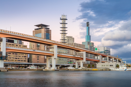 Kobe, Hyogo, Japan - November 22, 2018: Hamate By-pass road and buildings alongside port of Kobe with cloudy twilight sky.のeditorial素材