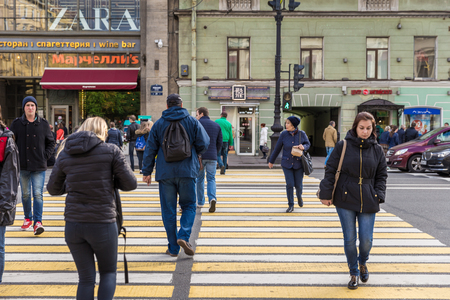 St. Petersburg, Russia - September 20, 2017: People hurry to walk on crosswalk of Nevsky avenue in rush hour.のeditorial素材