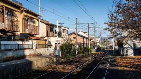 Kyoto, Japan - November 20, 2018: Keifuku Electric Railroad Kitano Line through local town of Ryoanji.のeditorial素材