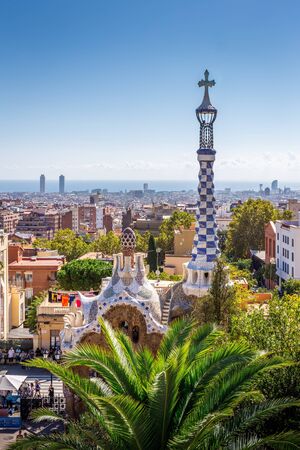 Barcelona, Spain - October 5, 2018: Aerial view on barcelona city with iconic mosaic tower of Park Guell, Gaudi's art building and park.のeditorial素材