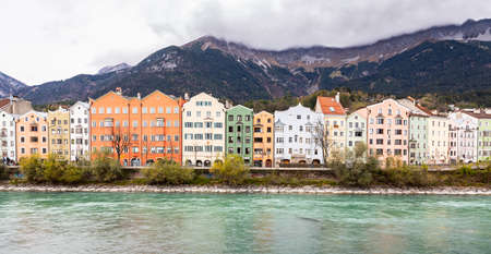 Innsbruck, Austria - November 3, 2019: Colorful buildings on street near Inn river at old city of Innsbruck, Tyrol.のeditorial素材