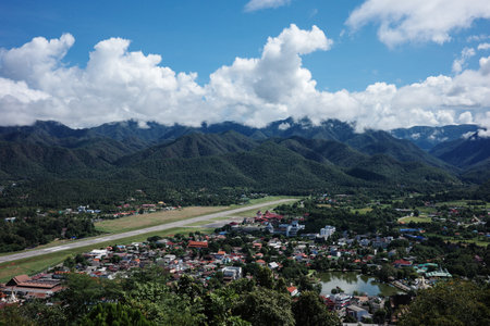 Aerial view of countryside landscape of Mae Hong Son province in Thailand surrounding by tropical rainforest mountain ranges with overcast sky of summer.の写真素材