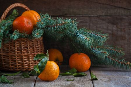 Christmas tangerines, old wooden background, russian new year tradition. Tonedの写真素材