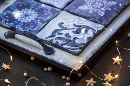 Christmas festive decorative handmade vintage white and blue tray salver. Toned.