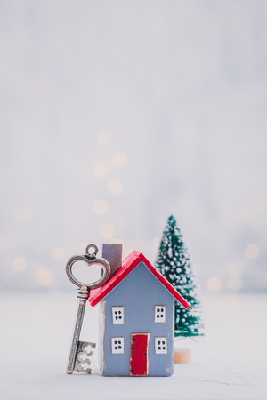 Small wooden house model, real estate, mortgage, property insurance and security, investment, money savings conceptの写真素材