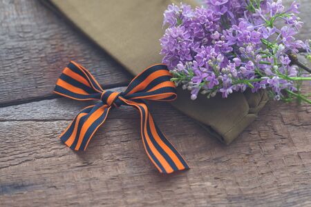 St. George ribbon on old wooden background, symbol of Victory Day May 9, tonedの写真素材