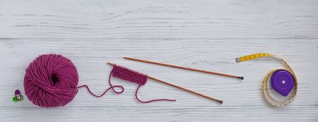Background with knitting tools and accessories, colorful skein yarn, hobby concept, copyspace, top...