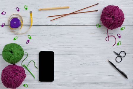 Background with knitting tools and accessories, colorful skein yarn, hobby concept, copyspace, top viewの写真素材