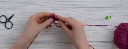 Background with knitting tools and accessories, colorful skein yarn, hobby concept, copyspace, top...