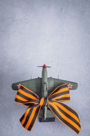 Traditional Saint George ribbon with aircraft model,Victory Day, May 9, selective focus, 23 February postcard conceptの写真素材