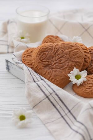 Easter heart shaped ginger cookies on the kitchen towel backgroundの写真素材
