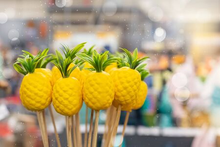 Yellow vivid exotic artificial pineapples for home plants decoration in Art Deco styleの写真素材
