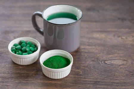 Chlorella or spirullina health-care products, pills, powder, liquidの写真素材