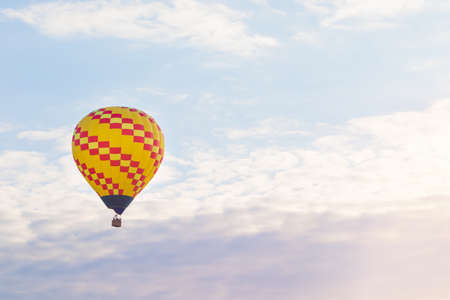 Colorful hot air balloon flying in the sky in summerの写真素材
