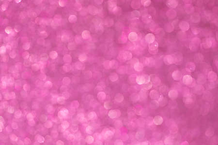 Vivid pink Christmas abstract background with bokeh defocused lightsの写真素材