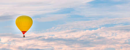 Colorful hot air balloon flying in the sky in summerの写真素材