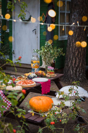 Assorted Italian food table setting in the garden, delicious snack on party or picnic time conceptの写真素材