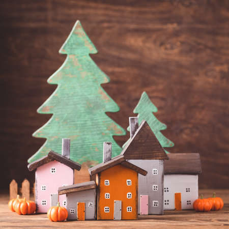 Miniature Thanksgiving Day little fairy autumn cottages, pumpkins, wooden background, postcard concept, tonedの写真素材