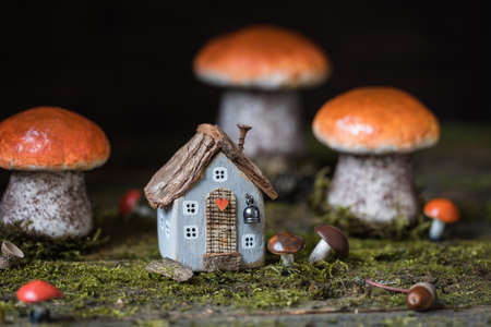 Miniature Thanksgiving Day little fairy autumn cottages, pumpkins, wooden background, postcard concept, tonedの写真素材
