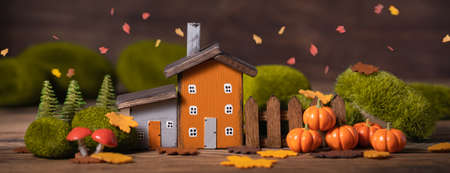 Miniature Thanksgiving Day little fairy autumn cottages, pumpkins, copyspace, wooden background, postcard concept, tonedの写真素材