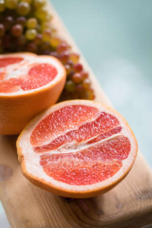 Healthy Organic Red Ruby Grapefruit on woodenの写真素材