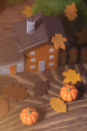 Miniature Thanksgiving Day little fairy autumn cottages, pumpkins, wooden background, postcard concept, tonedの写真素材