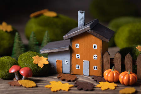 Miniature Thanksgiving Day little fairy autumn cottages, pumpkins, wooden background, postcard concept, tonedの写真素材