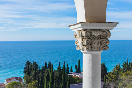 View from the balcony of bandoned building of the Soviet sanatorium Georgia in Gagra, Abkhazia, sunny seaside dayの写真素材