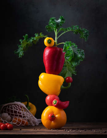 Fresh vegetables for summer soup piled up balancing on the wooden tableの写真素材