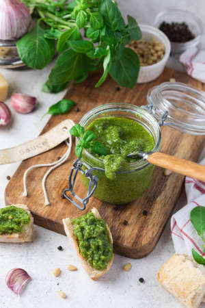 Homemade pesto on a rustic wooden table, selective focusの写真素材