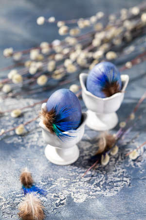 Dyed Easter eggs with marble stone effect painted with natural dye carcade tea from hibiscus flowers on old backgroundの写真素材