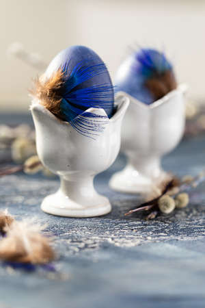 Dyed Easter eggs with marble stone effect painted with natural dye carcade tea from hibiscus flowers on old backgroundの写真素材
