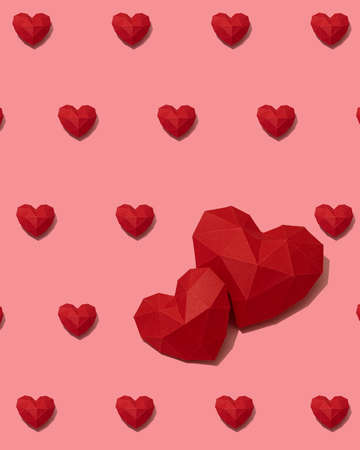 Red paper hearts pattern on pink backgroundの写真素材