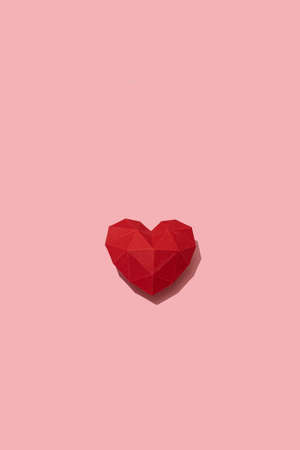 Red romantic paper heart isolated on pink background, Saint Valentine's, February 14, Mothers Day concept postcard, cardiology health symbol, pattern, space for textの写真素材