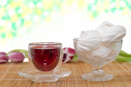 red tea, meringues and tulips on a napkin from caneの写真素材