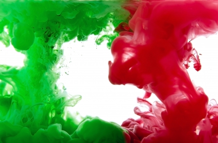 Dissolving liquid pigments in waterの写真素材