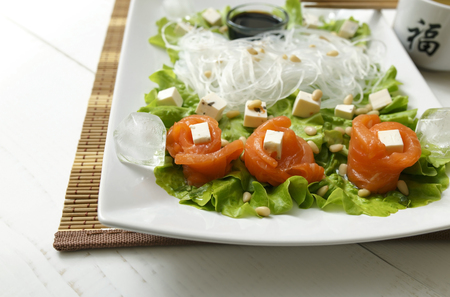 salmon rolls in a cold salad with iceの写真素材