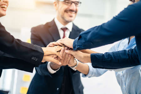 Group handshake of successful colleague team members together after completed seminar meeting. They...