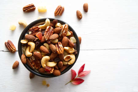Mix nuts and dried fruits background and wallpaper. Seen in top view of mix nuts and dried fruits in...