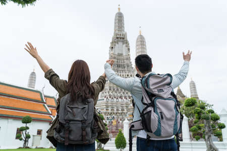 Asian attractive romantic couple travel in the city for honeymoon trip. Young new marriage man and...