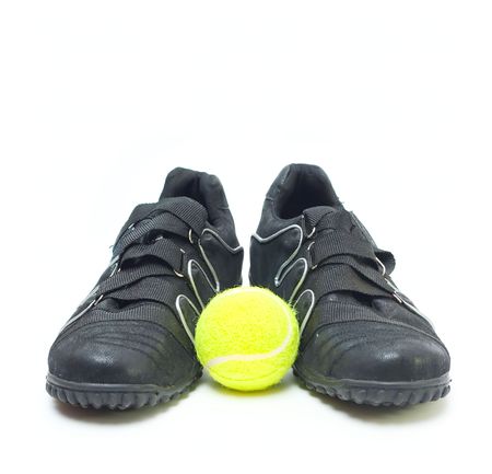 Sport shoes and ball isolated on whiteの写真素材
